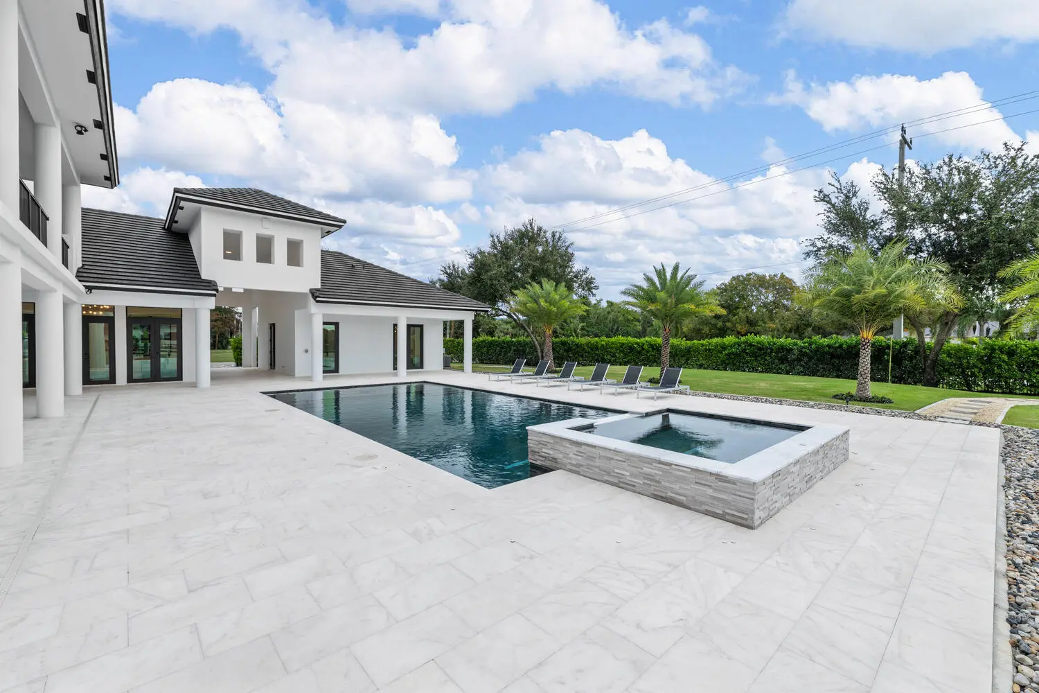 Image a pool in the backyard of a home